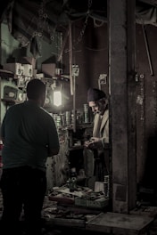 A cozy family workshop with artisans carefully assembling personalized gift boxes.