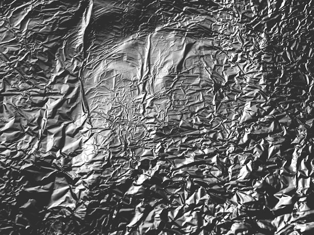 A close-up of shiny aluminum scraps ready for recycling in a workshop.