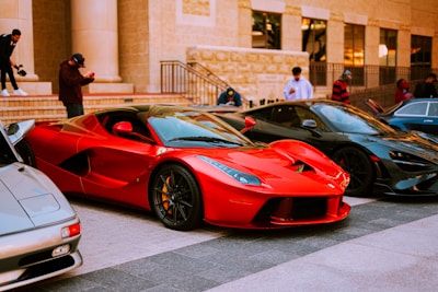 red ferrari 458 italia on road during daytime