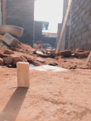 Close-up of a professional inspector examining building materials on site.