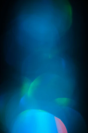 Artistic display of blue color swatches blending into each other with soft lighting.