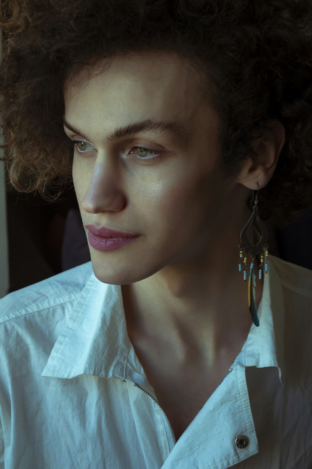 woman in blue and white collared shirt