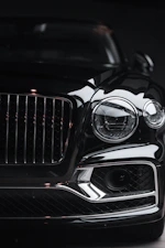 silver car headlight in grayscale photography