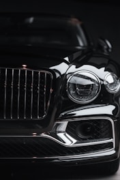 silver car headlight in grayscale photography