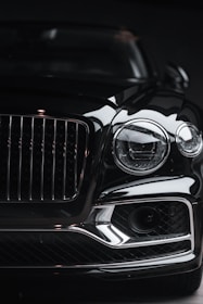 silver car headlight in grayscale photography