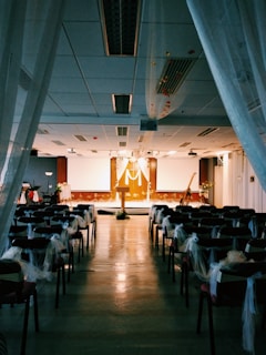 people sitting on chairs inside room