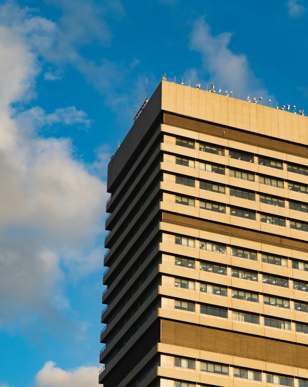 brown concrete building under blue sky during daytime