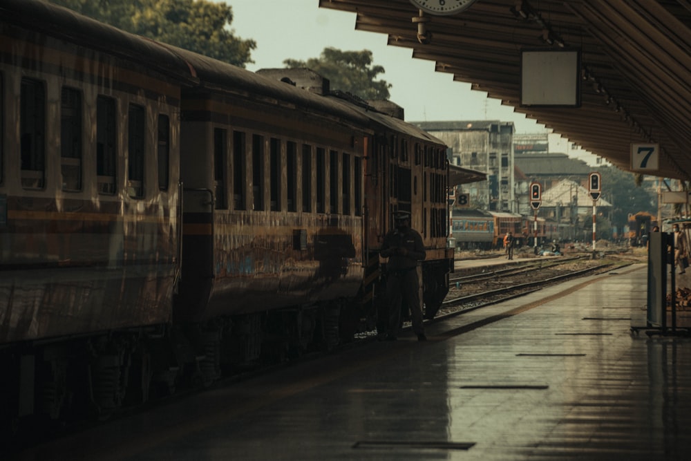 white and red train on rail tracks during daytime