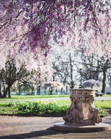 A serene illustration of Rati, Manmatha’s consort, amidst a garden of spring blossoms.