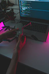 A futuristic workspace with holograms of robots and drones illustrating tech career paths.