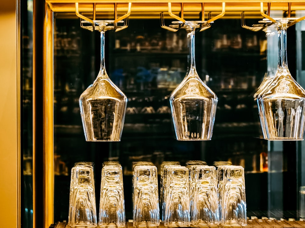 clear glass jars on brown wooden shelf