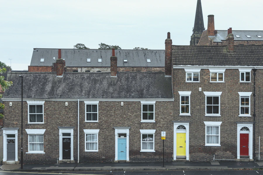 A row of terraced cottages with colourful front doors