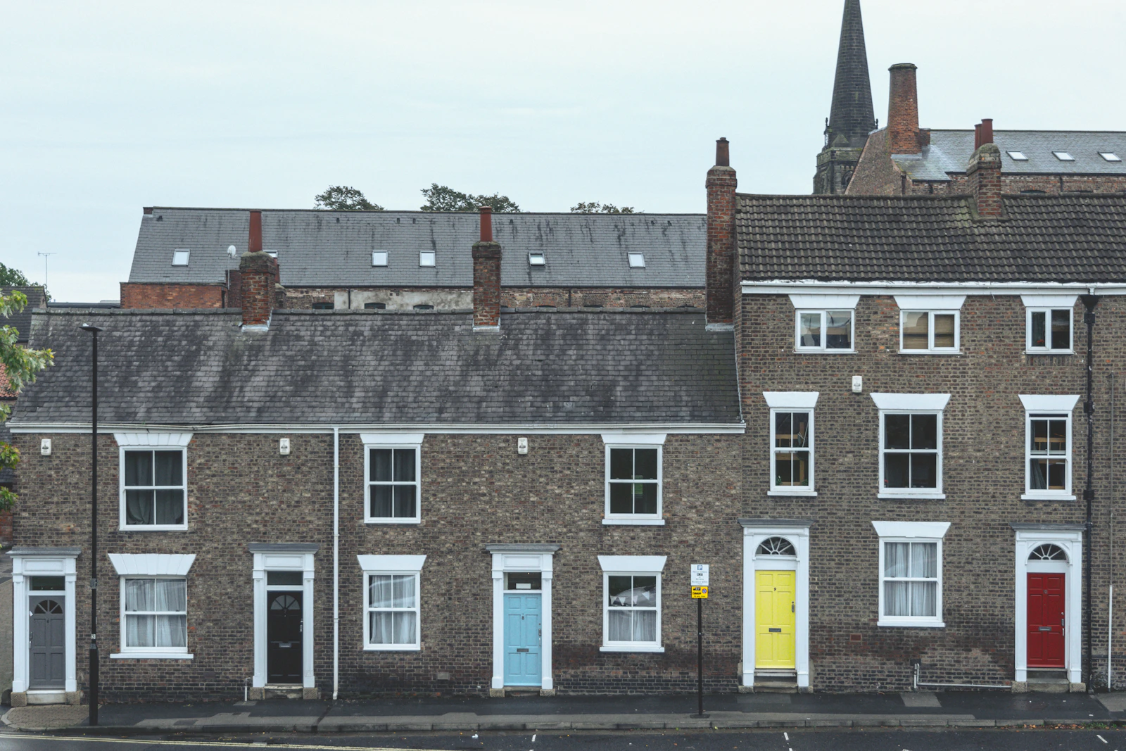 A row of brick terraced houses on a British street