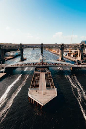 gray concrete bridge over body of water during daytime in newcastle