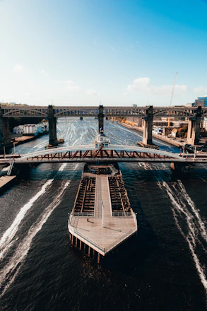 gray concrete bridge over body of water during daytime in newcastle