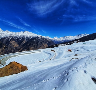 snow covered mountain under blue sky during daytime