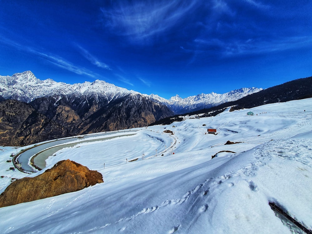 snow covered mountain under blue sky during daytime