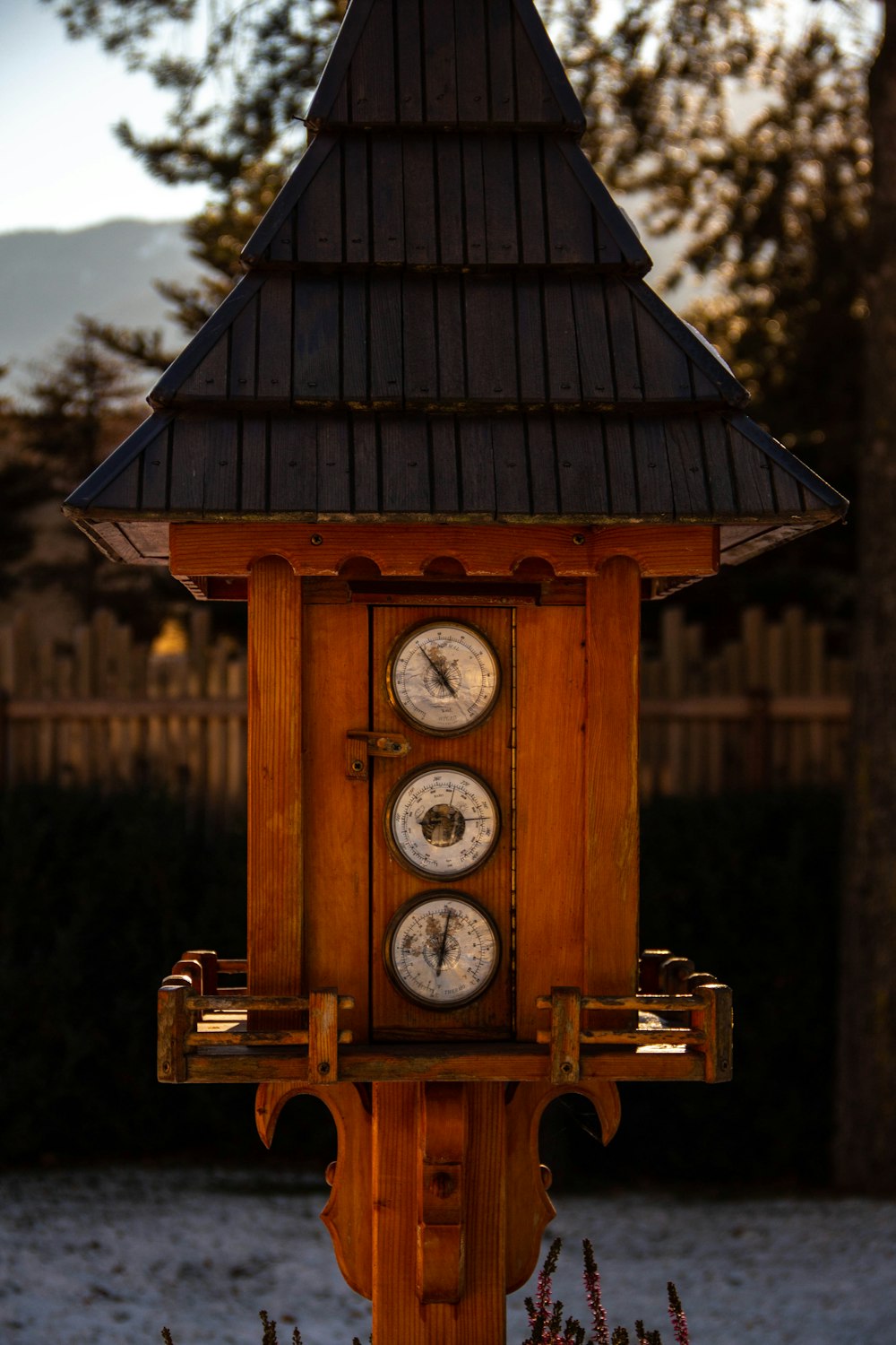 brown wooden analog clock on brown wooden table