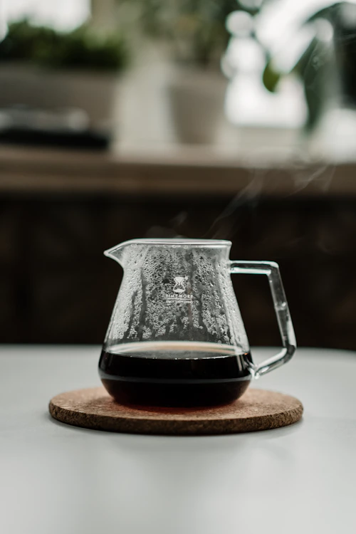 Pour-over coffee brewing through a glass dripper