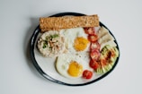 egg and vegetable salad on white ceramic plate