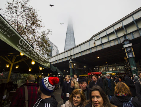 Cinematic drone footage capturing a bustling Leicester market from above.