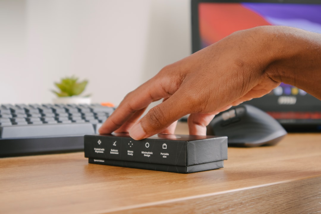 person holding black remote control