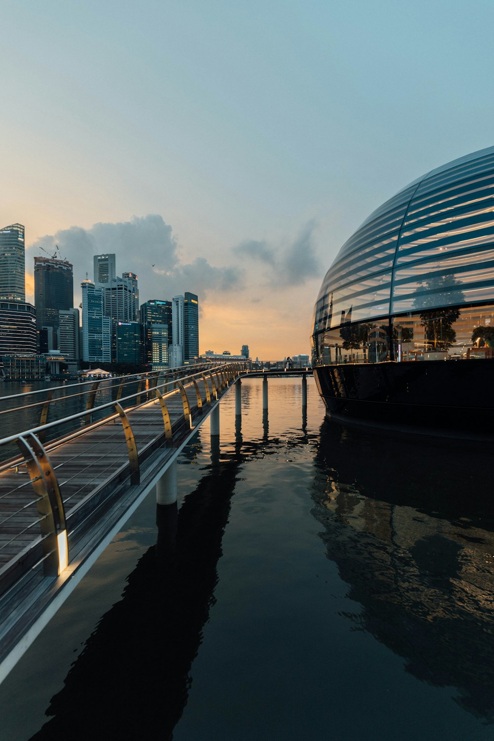 glass building near body of water during daytime