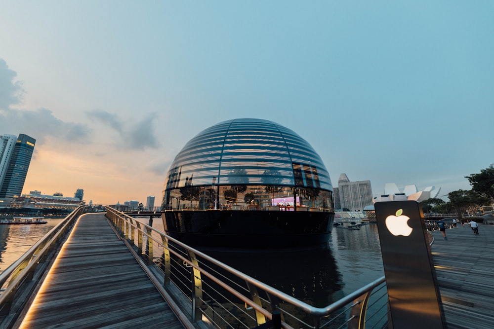 glass building near body of water during night time