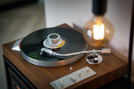 A cozy vintage record player spinning a vinyl under warm ambient lighting.