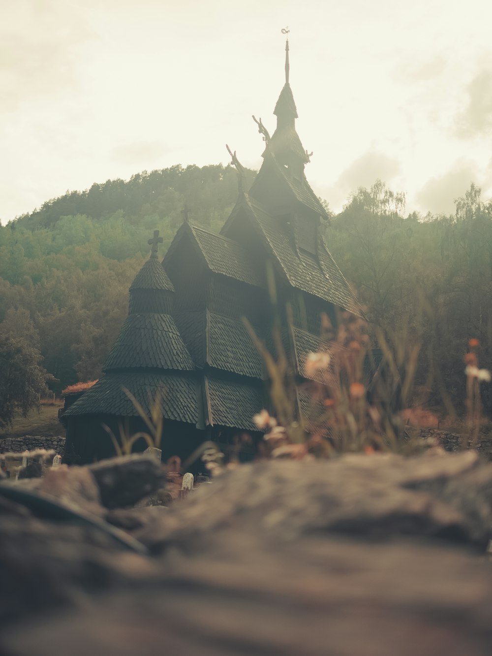 brown wooden house on brown rocky ground during daytime