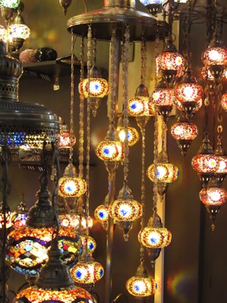Close-up of traditional Arabic lanterns casting a cozy glow on the dining area aboard the cruise.
