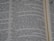 A close-up view of an opened book showing printed text in English. The focus is on the text in the central column, with surrounding text appearing slightly blurred due to the shallow depth of field.