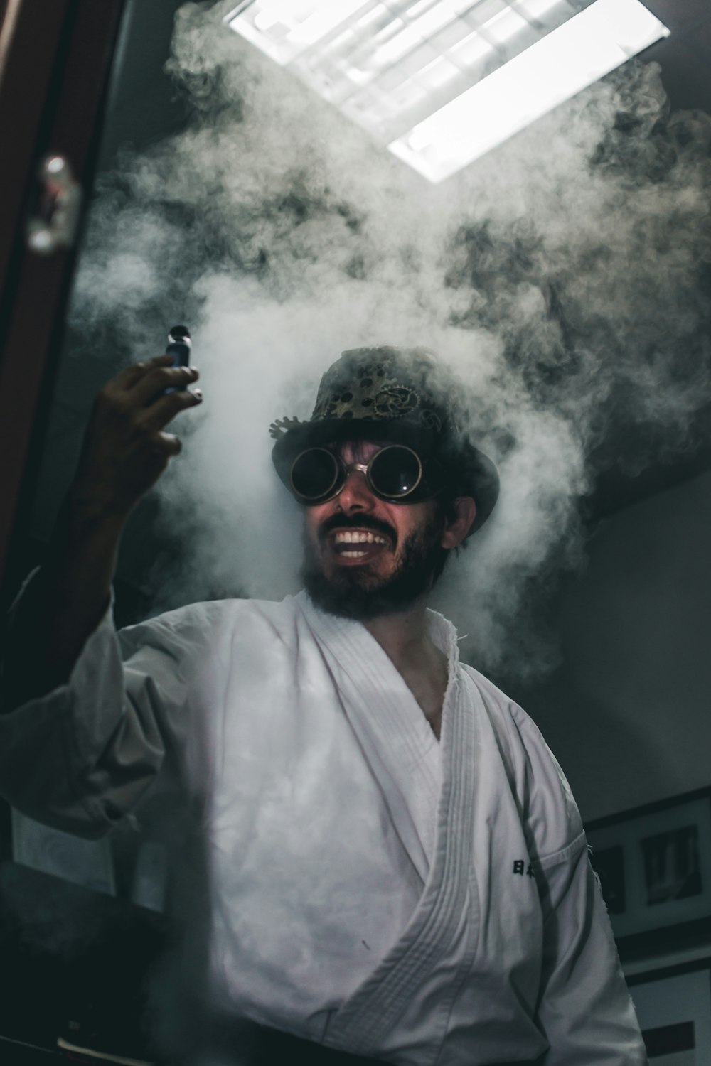 man in white button up shirt smoking