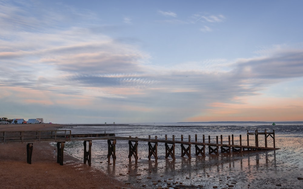 brown wooden dock on sea during daytime