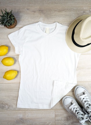 A flat lay of the essential organic tee styled with accessories.