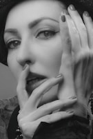 An elegant portrait of a model in a stylish outfit.
