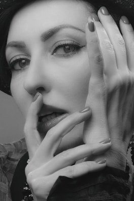 A charismatic celebrity with an inviting gaze and elegant attire.