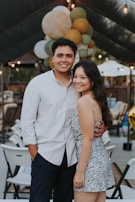 Smiling couple celebrating a financial milestone at home.