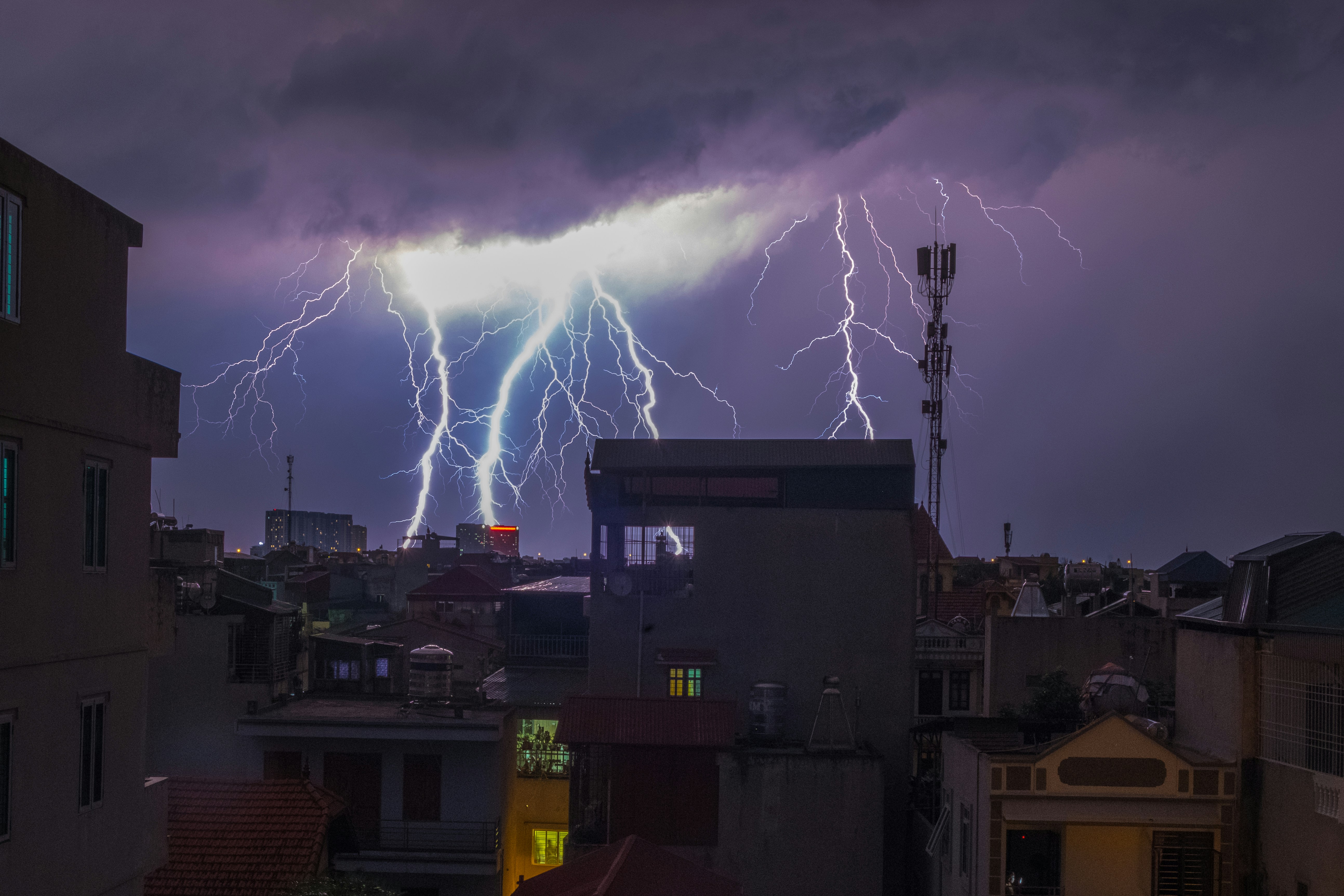 A group of lightning strikes over a city photo – Free Hà nội Image on ...