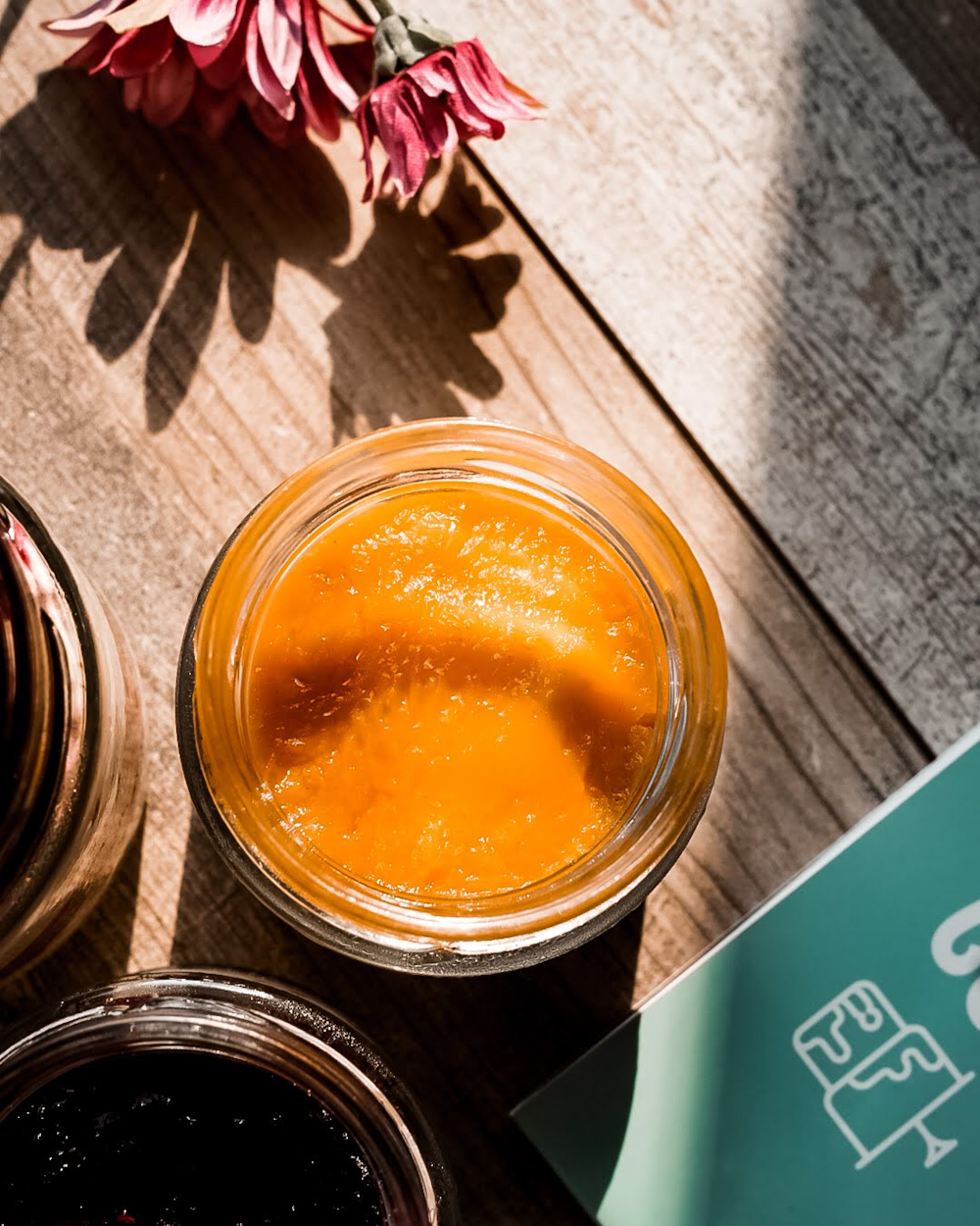 clear glass jar with orange liquid