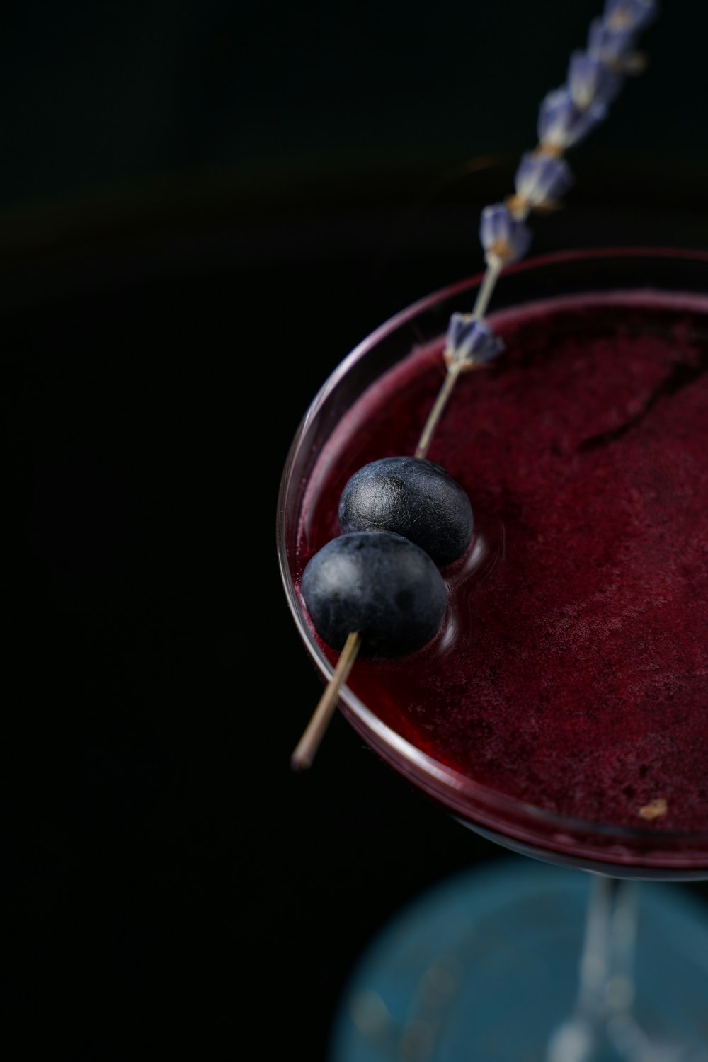 black round fruit on red round plate