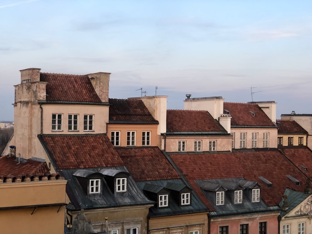 brown and white concrete houses under blue sky during daytime