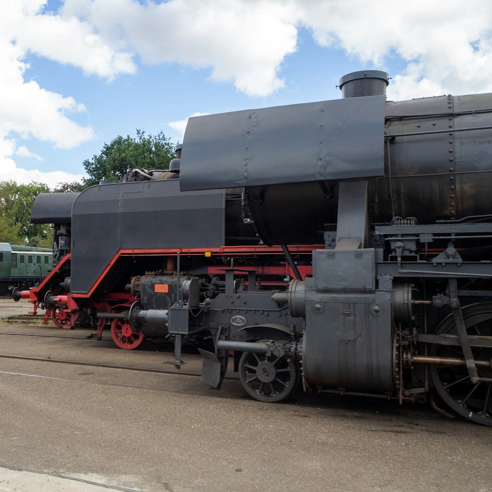 black and red train under blue sky during daytime