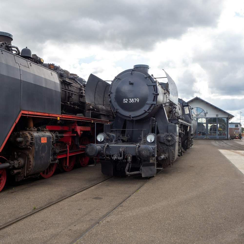 black and red train under cloudy sky during daytime