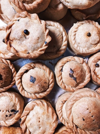brown round pastry on brown wooden table