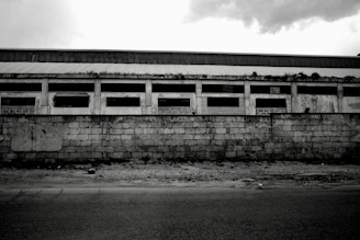 Historic black-and-white photo of the original Wolong Diamond Factory exterior.