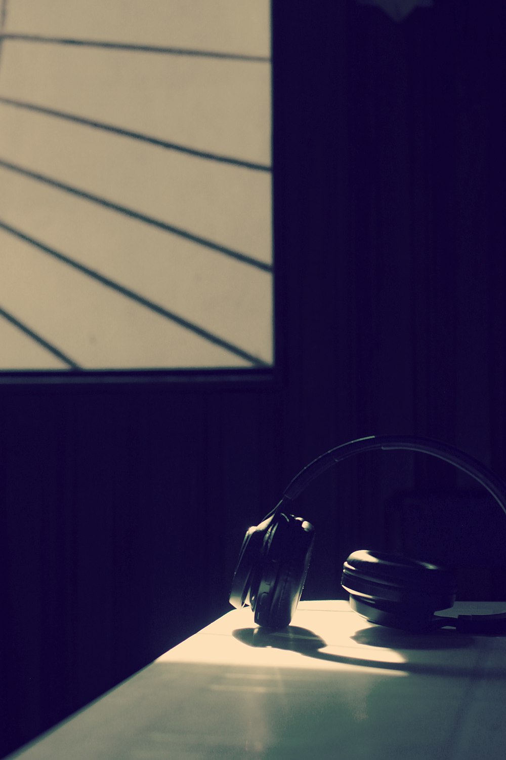 black headphones on black table