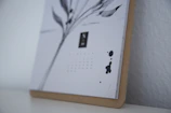 Close-up of a minimalist digital print featuring elegant calligraphy on matte paper.