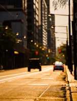 A vibrant still from a short film showing a city street bathed in golden hour light.