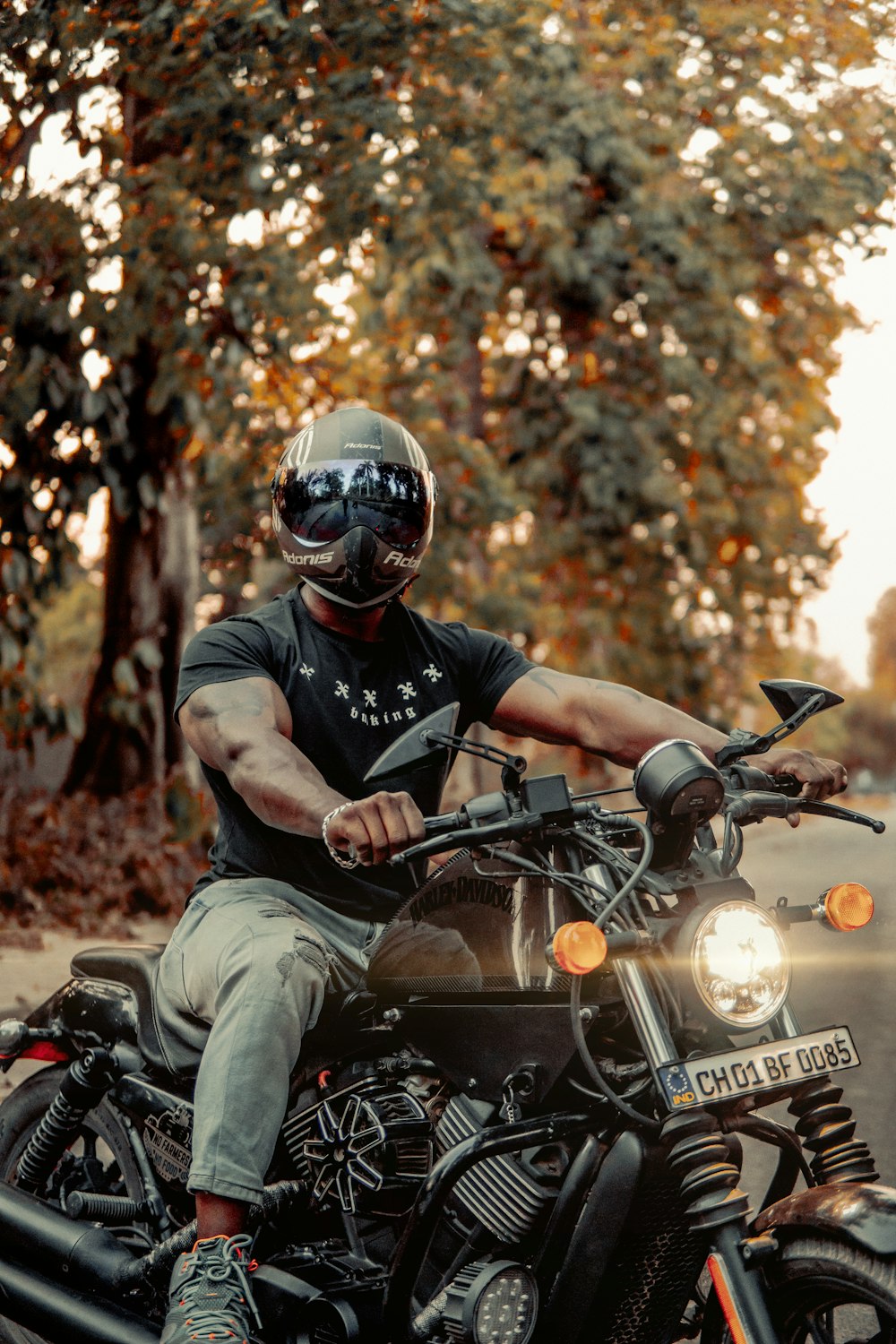 man in black helmet riding on black motorcycle